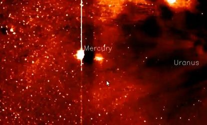 The bright spot just below Mercury has some conspiracy theorists convinced that there's a giant alien spacecraft hanging out in our solar system.