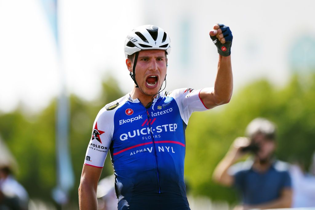MUSCAT OMAN FEBRUARY 13 Fausto Masnada of Italy and Team QuickStep Alpha Vinyl celebrates winning during the 11th Tour Of Oman 2022 Stage 4 a 1195km stage from Al Sifah to Mucat TourofOman on February 13 2022 in Muscat Oman Photo by Dario BelingheriGetty Images