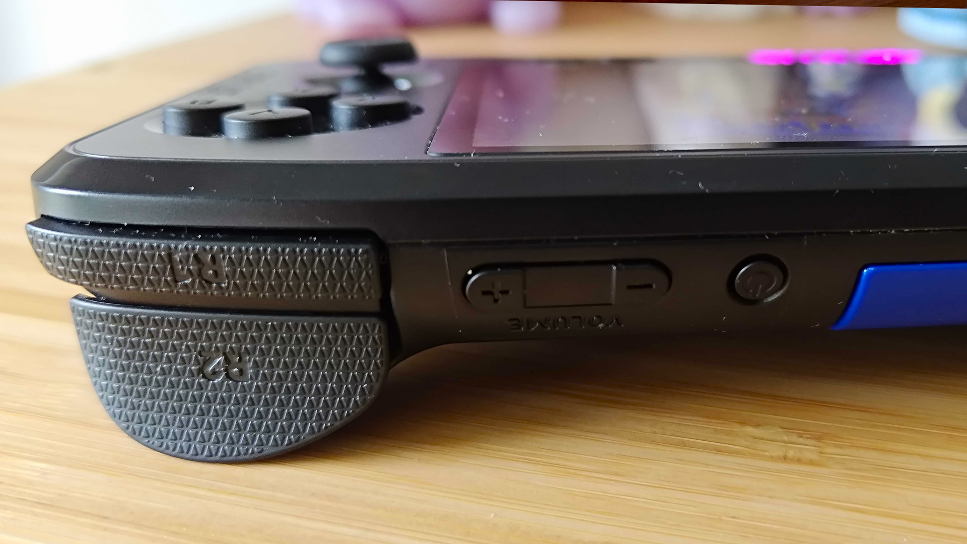 Close up of Evercade Nexus top power button and volume controls.