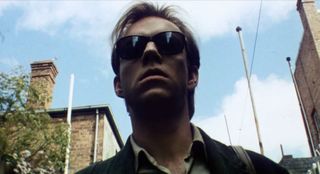 Hugo Weaving wearing dark glasses