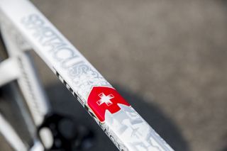 Custom decoration on the top tube includes a Swiss flag