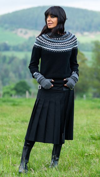 Claudia Winkleman wearing a Fair Isle jumper, skirt and boots