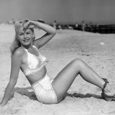 vintage photo of a woman in a high waisted bikini