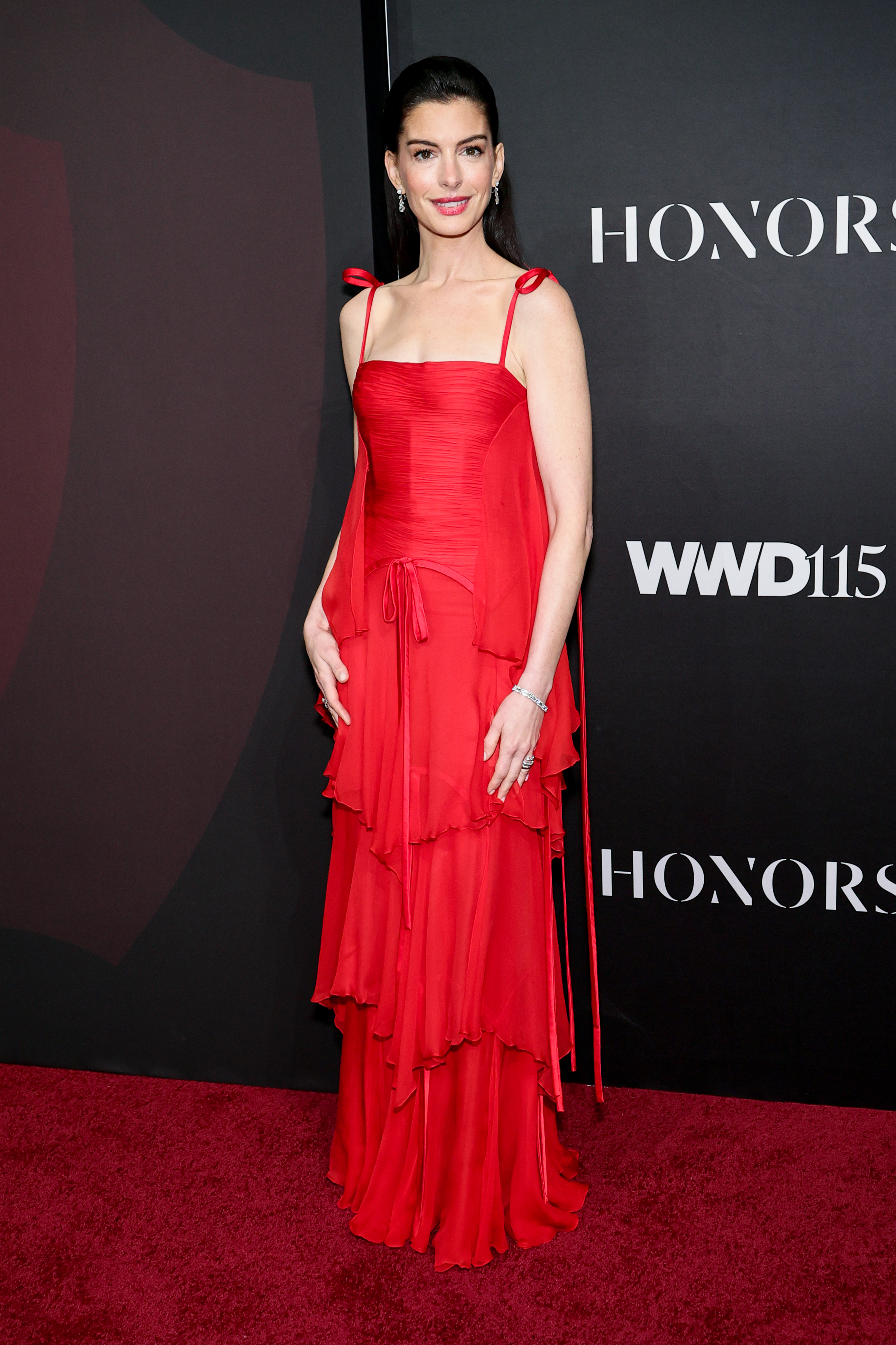Anne Hathaway wearing vintage Valentino red dress