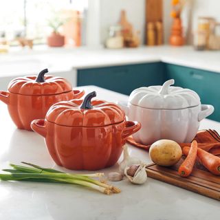 Pumpkin shaped casserole dish on countertop