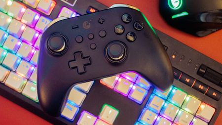 GuliKit KingKong 2 Pro Controller on a keyboard