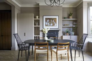 A dining room with taupe colors on walls