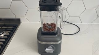KitchenAid K150 blender filled with hazelnuts ready to be crushed