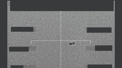 Two small dots on a head's-up display.