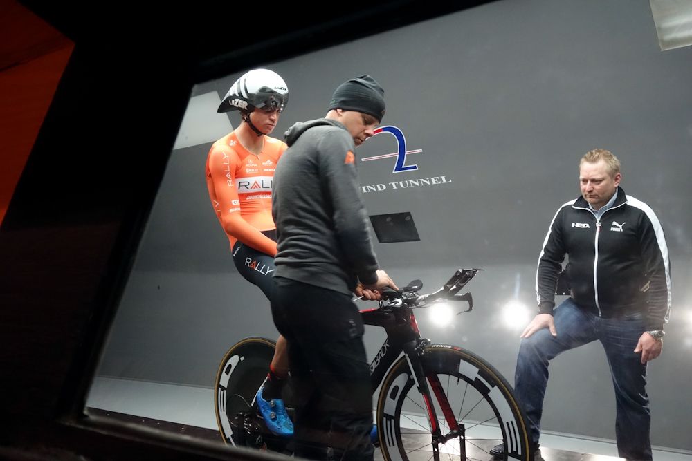 Team mechanic Rick Barrow and Christopher "Dino" Edin from HED make adjustments to Sepp Kuss&rsquo;s position.