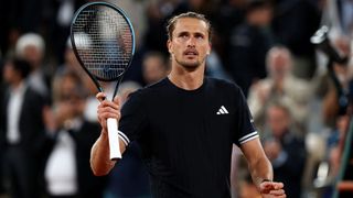 Alexander Zverev raises his racket to acknowledge the fans at the French Open 2026.