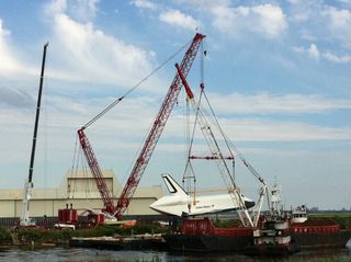 Shuttle Enterprise Lifted by Crane onto Barge