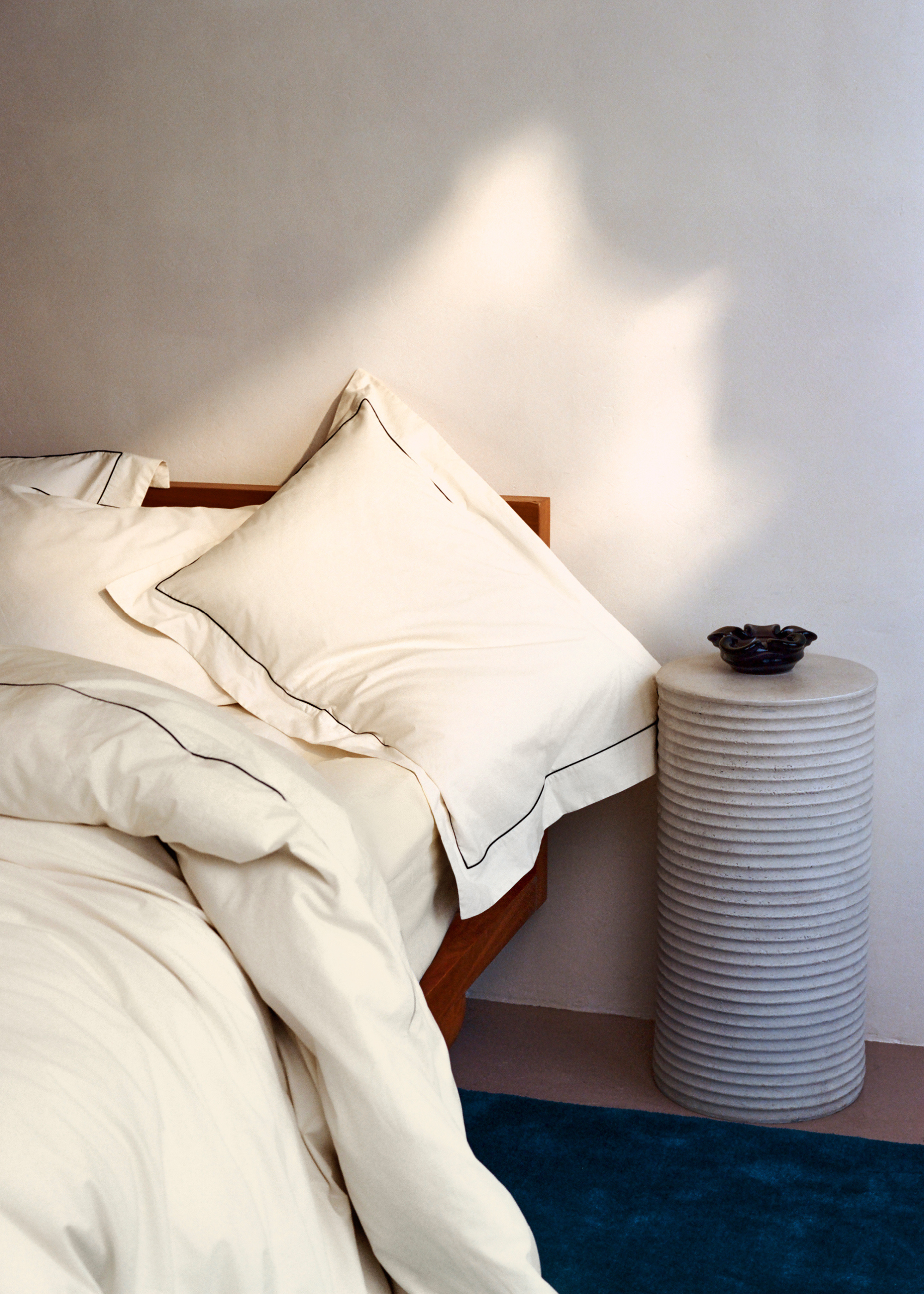 A bedroom with Rise &amp;amp; Fall's wool-filled duvet