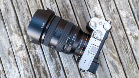 Sony FE 20-70mm F4 G attached to Sony A7C on wooden table