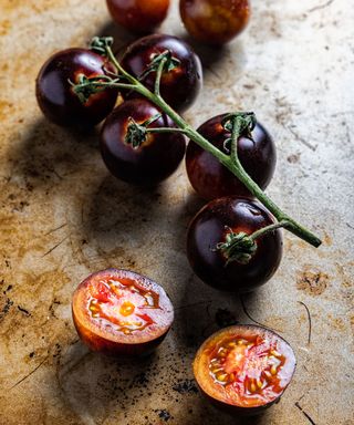 tomato Black Cherry variety fruits freshly harvested and sliced