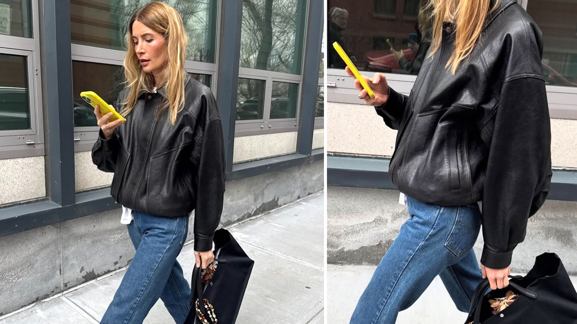 NYC style influencer Courtney Grow walks on the street while looking at her yellow phone wearing a black leather bomber jacket, jeans, and a black top-handle tote bag