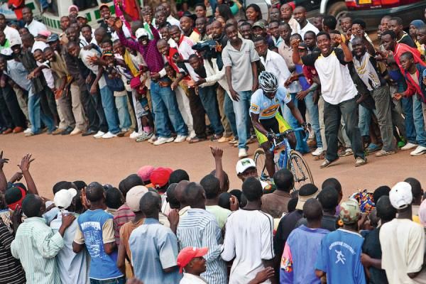 Abraham Ruhumuriza gets support from the crowd as he heads to the finish in his home town of Butare.