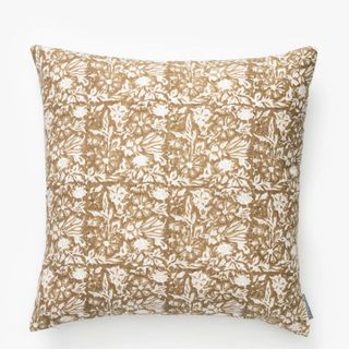 White and brown floral patterned throw pillow