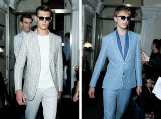 Guys wearing Gieves & Hawkes S/S 2015 collection. On the left the guy is wearing a chalky white pants, white t-shirt, striped chalky white jacket and sunglasses. On the right, the guy is wearing a sky blue shirt, dark blue scarf and sky blue suite and sunglasses