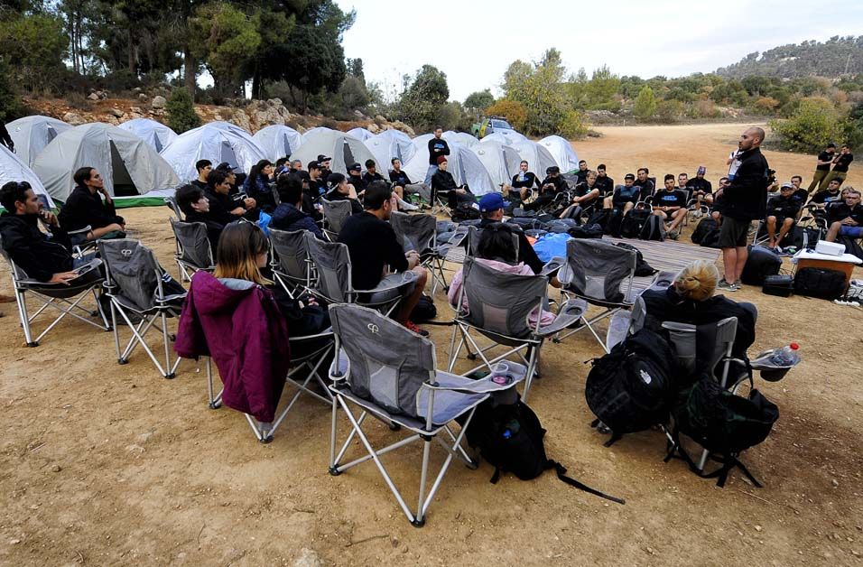 Team manager Ran Margaliot talks to the team when they arrive at their overnight spot