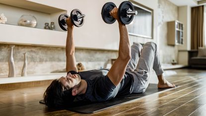 Man doing a new kind of dumbbells workout