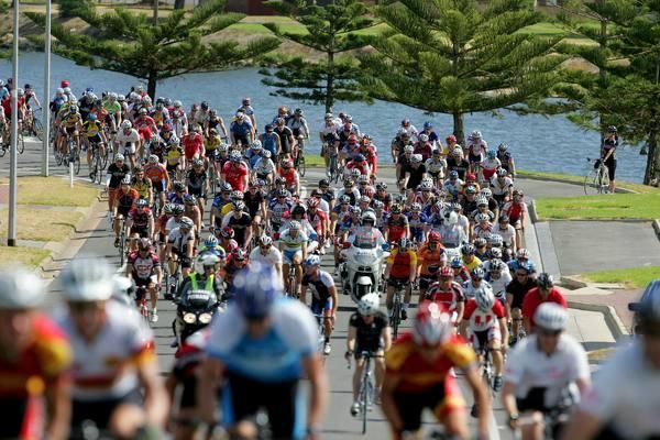 Some of the massive group rolls out behind Lance Armstrong behind the Police escort.