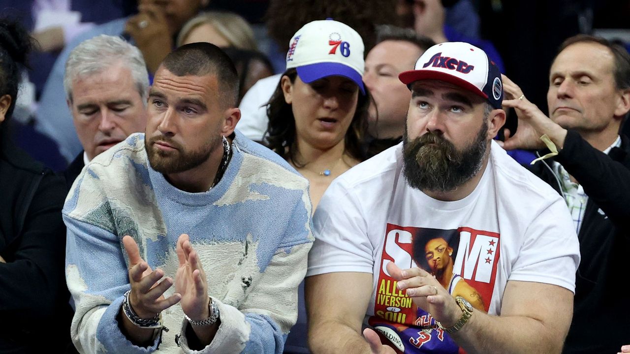 Travis and Jason Kelce watch the Boston Celtics v Philadelphia 76ers game