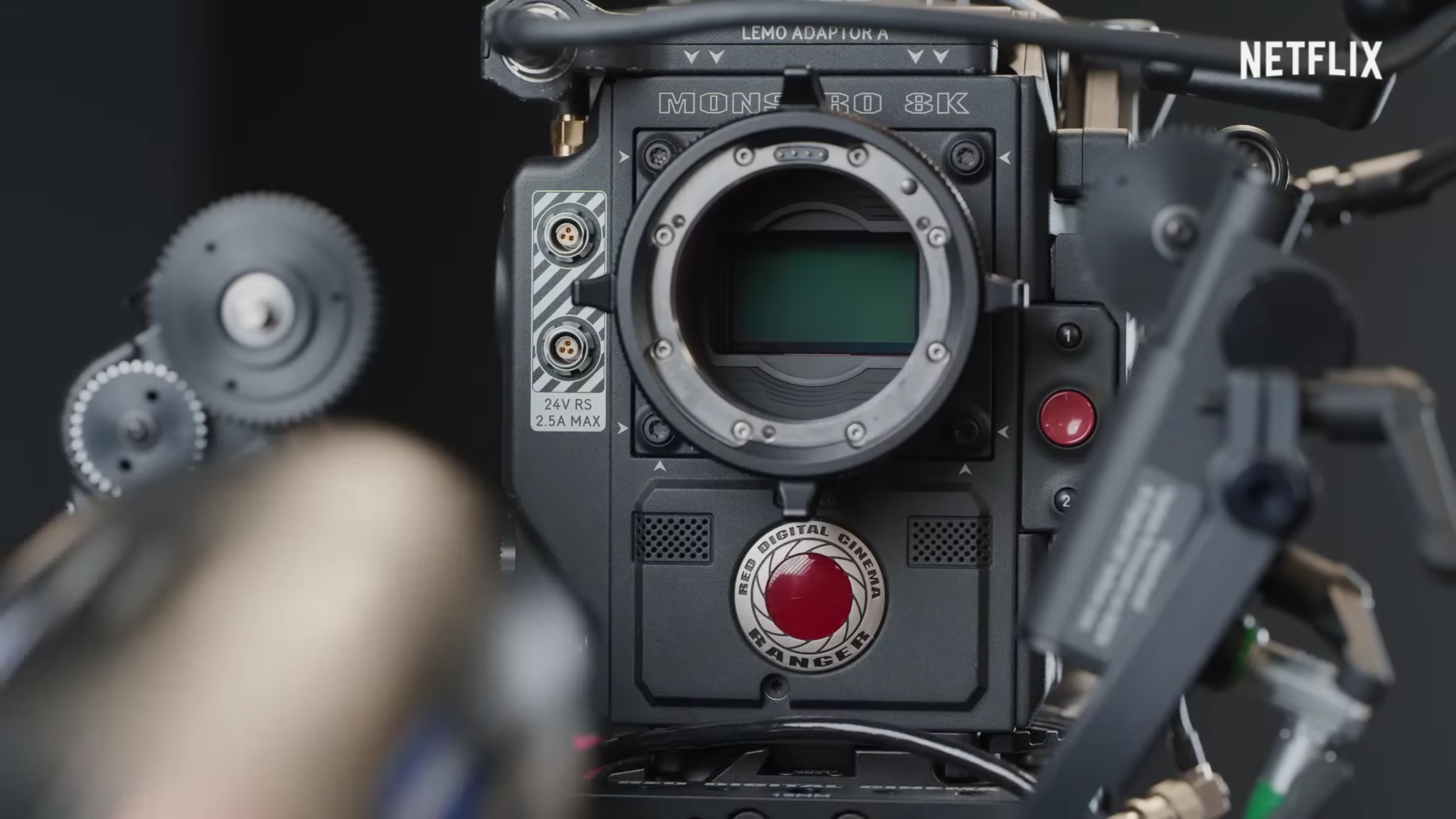 A close-up of a professional video camera