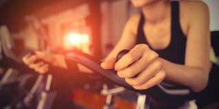 Image of woman enjoying exercise bike benefits