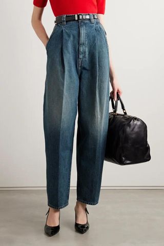 Khaite Ashford pleated high-rise tapered jeans