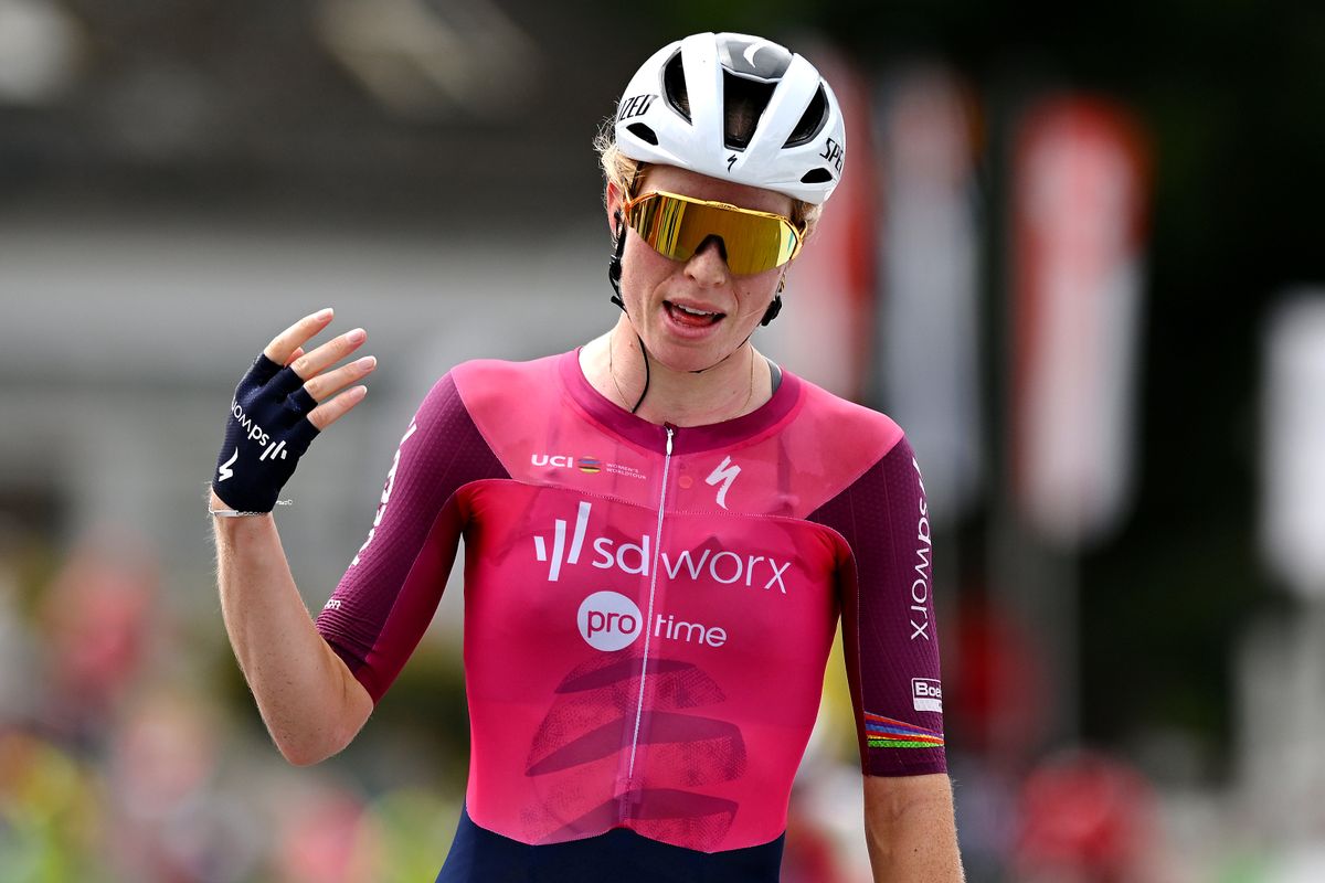 Demi Vollering celebrates past the line at Tour de Romandie stage 2