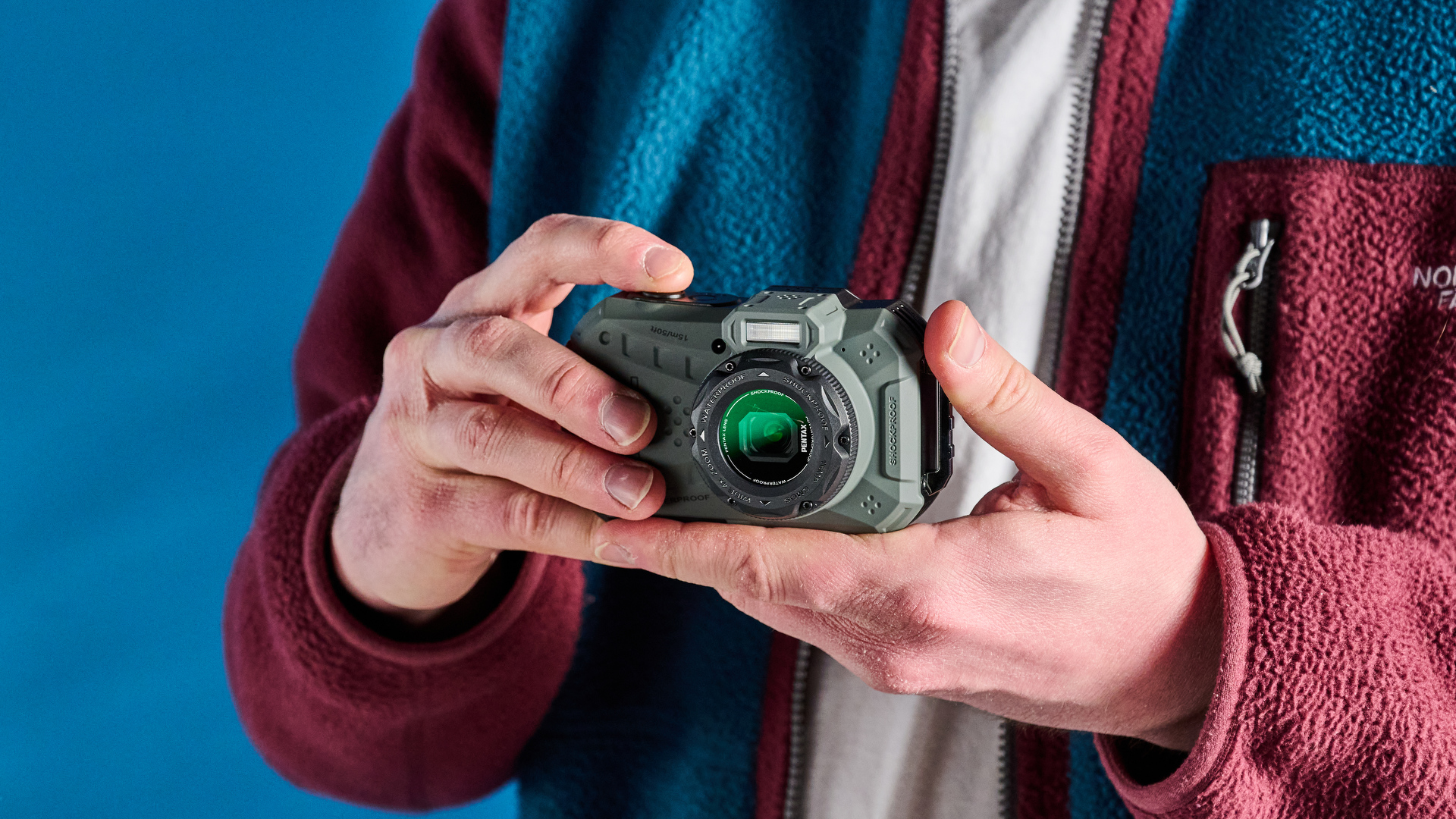 Image of the Pentax WG-1000 taken in front of a blue background