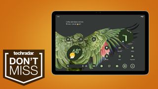 Google Pixel Tablet on an orange TechRadar deals background