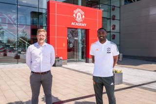 Manchester United head of academy Nick Cox and Justin Cochrane at the training complex (Man Utd)