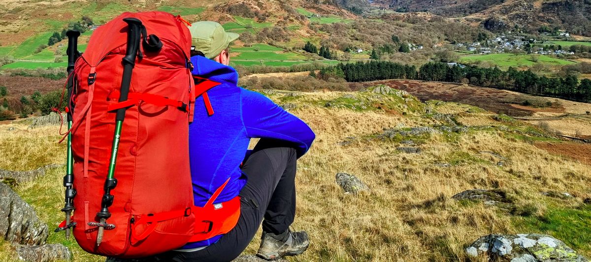 Man wearing Deuter Guide 44+8 mountaineering pack