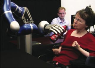 Using the BrainGate brain computer interface, a tetraplegic patient controls a robotic arm with her brain.