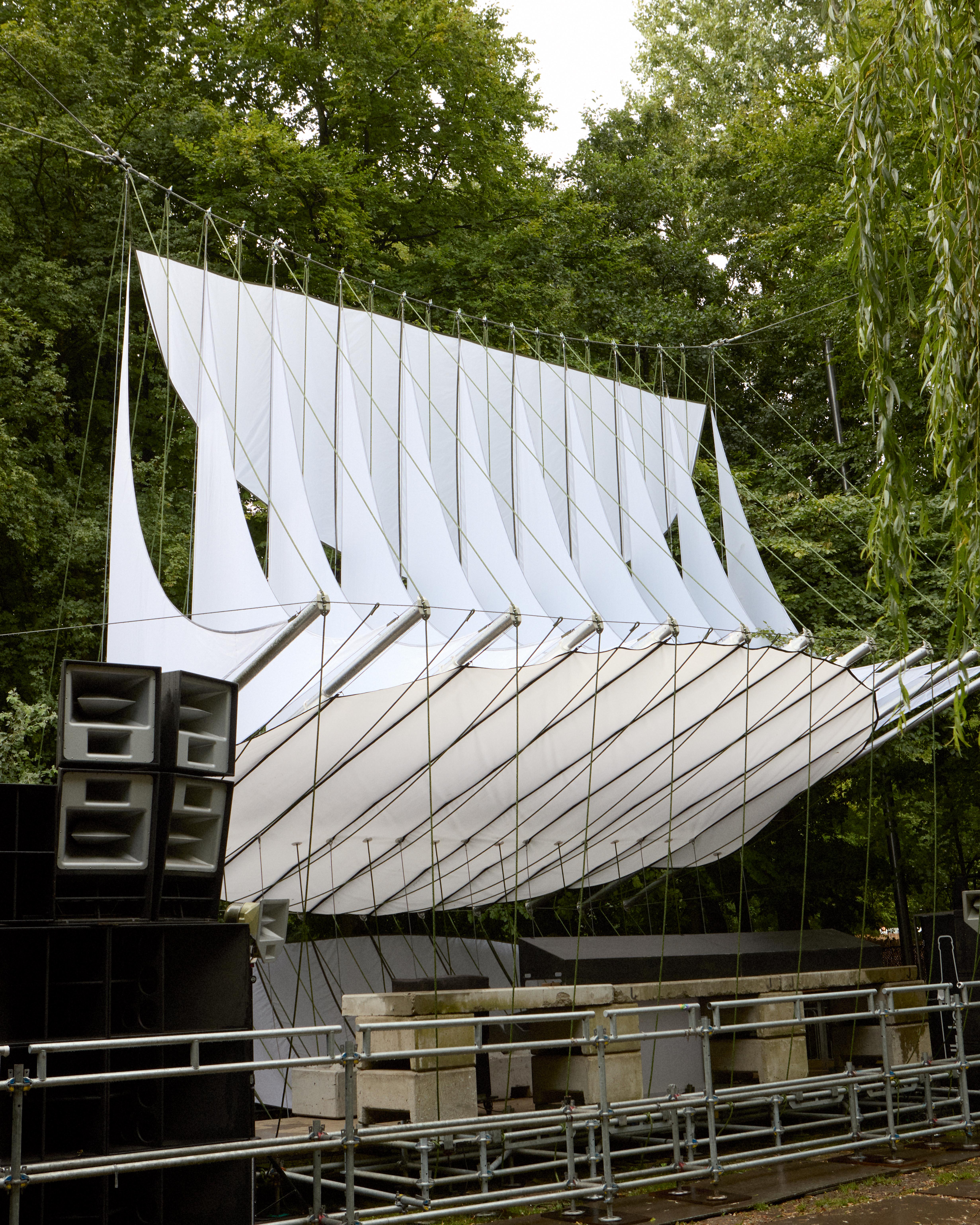 At Dekmantel Festival, a white tent over a stage in the woods