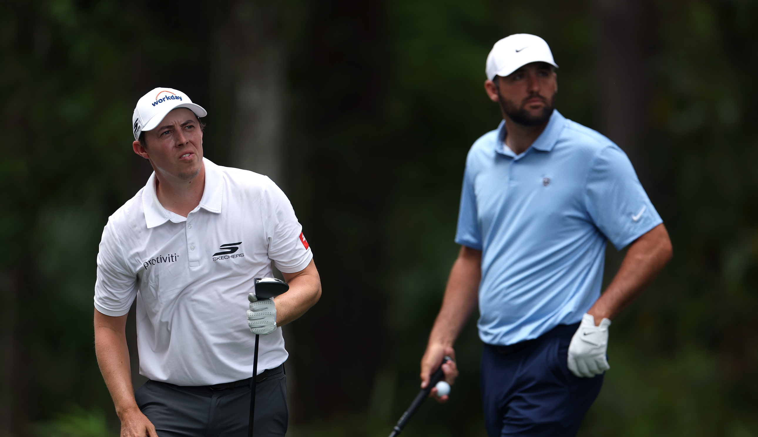 Matt Fitzpatrick and Scottie Scheffler watch a tee shot