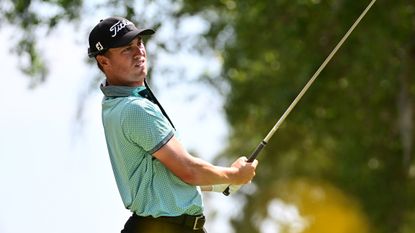 Justin Thomas looks on after hitting a drive at the Valspar Championship