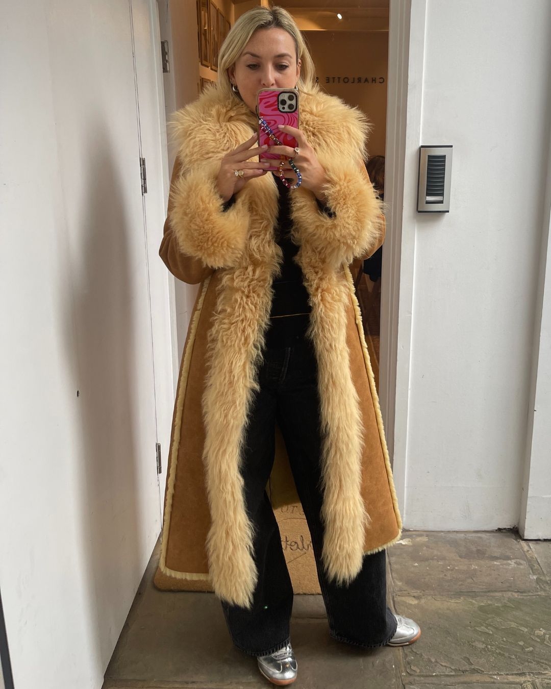 Clementina Jackson tries on the charlotte simone indie coat