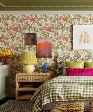 A maximalist bedroom with seven layered patterns in bright colors