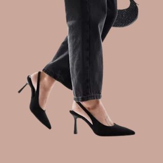 flat lay cropped image of woman wearing black heels 