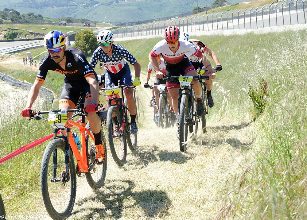 Payson McElveen (Orange Seal) riding with the leaders