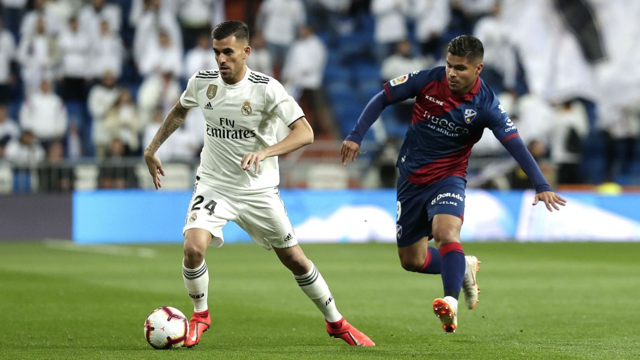 Real Madrid midfielder Dani Ceballos (left) in action against Huesca in La Liga 