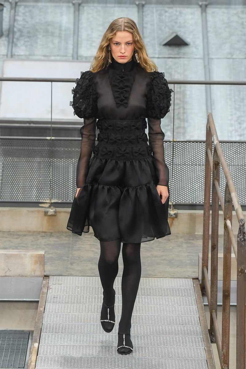 Fashion model, Clothing, Fashion, Fashion show, Black, Runway, Fur, Dress, Street fashion, Tights,