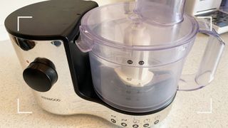 Zoomed in image of a food processor showing how to lock the jug. into the base for step 2 of how to clean a food processor