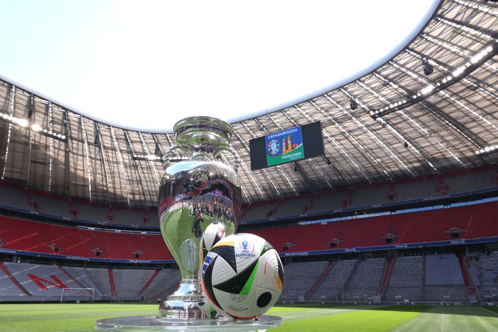 The UEFA EURO 2024 Winners Trophy is pictured with the official adidas matchball Fußballliebe in the Allianz Arena during the UEFA Euro 2024 Trophy Tour on May 13, 2024 in Munich, Germany. (Photo by Alexander Hassenstein - UEFA/UEFA via Getty Images)