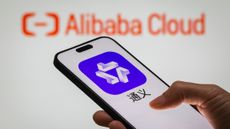 A smartphone displays Alibaba's AI-powered assistant Tongyi. 