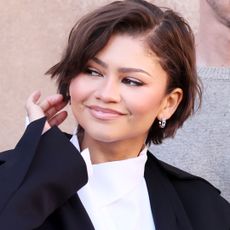 Zendaya was spotted on 'The Drama' press tour wearing a classic black-and-white work suit