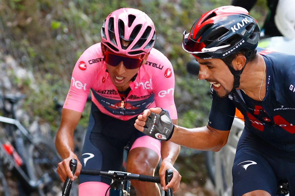 Team Ineos rider Colombias Daniel Martinez R encourages his teammate overall leader Team Ineos rider Colombias Egan Bernal as they ride in the last ascent during the 17th stage of the Giro dItalia 2021 cycling race 193km between Canazei and Sega di Ala on May 26 2021 Photo by Luca Bettini POOL AFP Photo by LUCA BETTINIPOOLAFP via Getty Images